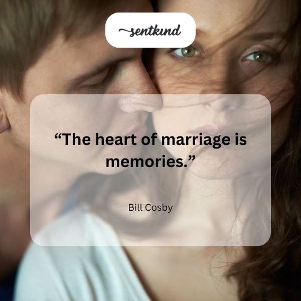 A happy couple embraces, surrounded by framed photographs.