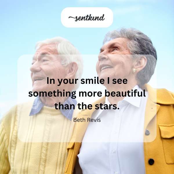 A person smiles warmly, their face softly lit.