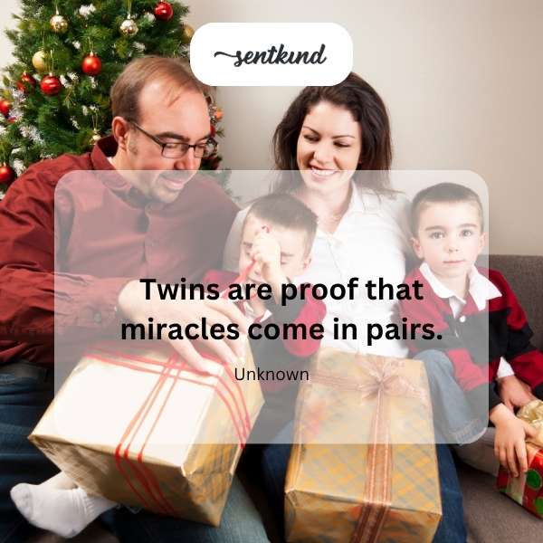 Identical twins smiling and holding hands.