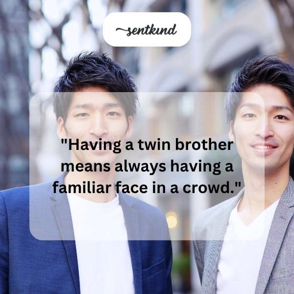 Two identical men stand side by side, smiling.
