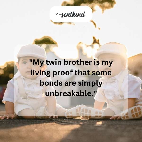 Two identical men standing side-by-side, smiling.