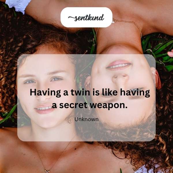 Two identical twins stand back to back, symbolizing strength and unity.