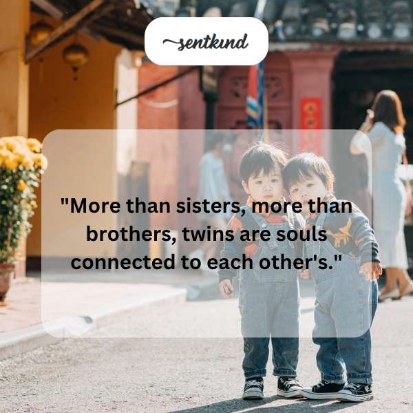 Identical twins are embracing each other warmly.