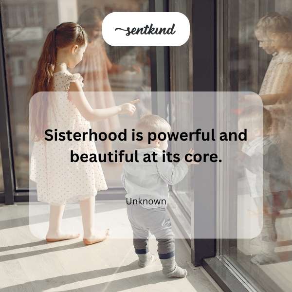 A diverse group of women stands close together, smiling and looking empowered as a collective.