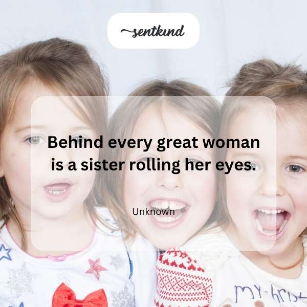 An image showing two sisters, one standing confidently and smiling forward while the other sister behind her subtly rolls her eyes.