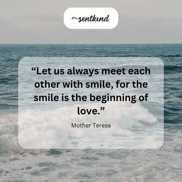 A person smiling warmly at another person.