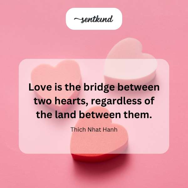 A heart-shaped bridge connects two hearts across a landscape.