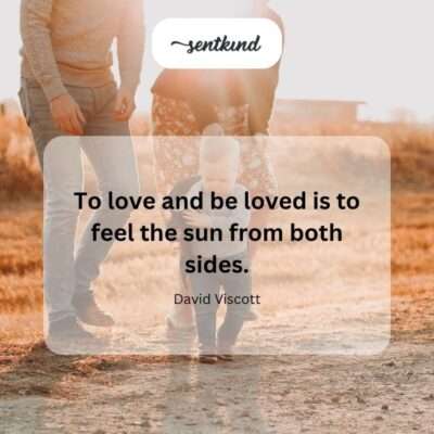 A silhouette of two people embracing as warm golden light surrounds them.