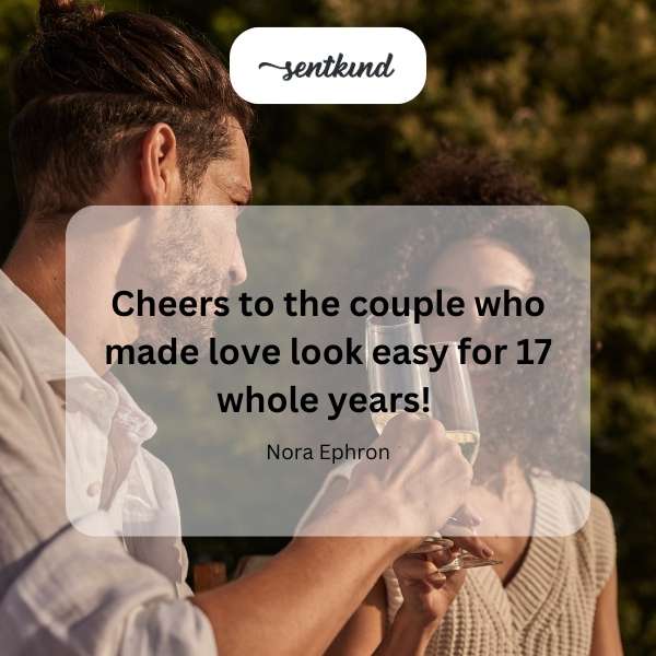 A couple smiling and holding hands at their 17th anniversary celebration.