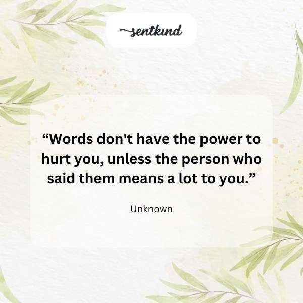 A gentle hand reaches out to comfort another hand, symbolizing support and connection against a soft, blurred background.
