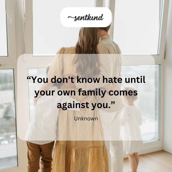 A person sits alone on a bench, gazing sadly into the distance, with a blurred backdrop suggesting emotional distance or regret.