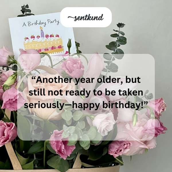 A person holding a vintage photo with birthday wishes.