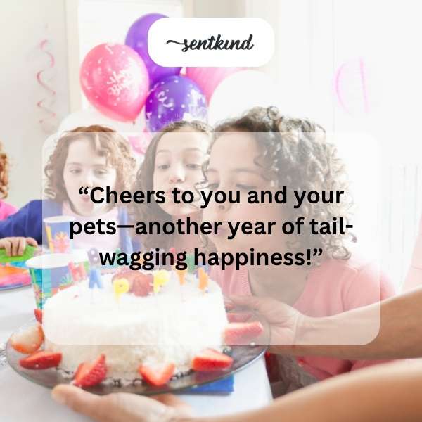 A person holding a birthday cake next to a dog with a treat.