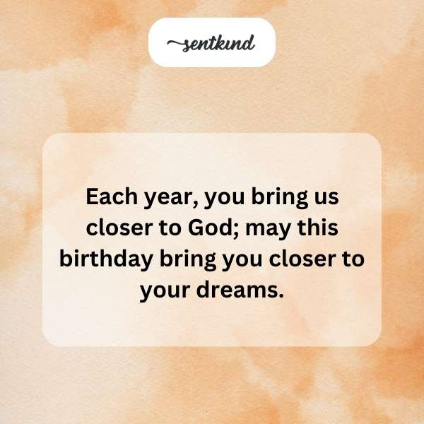 A birthday cake is surrounded by glowing hearts and a soft, radiant light.