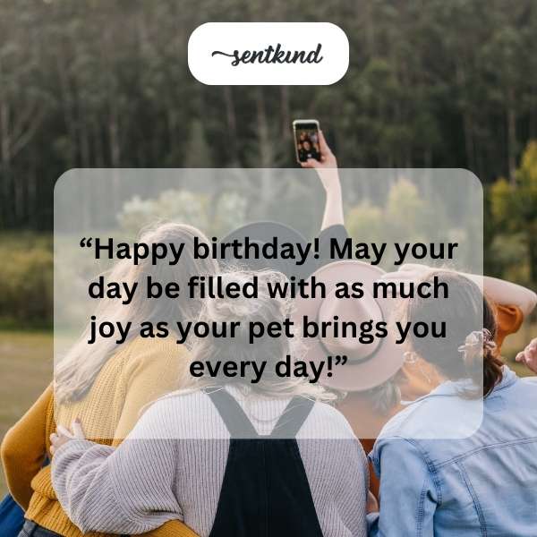 A dog and cat happily clink glasses filled with milk.