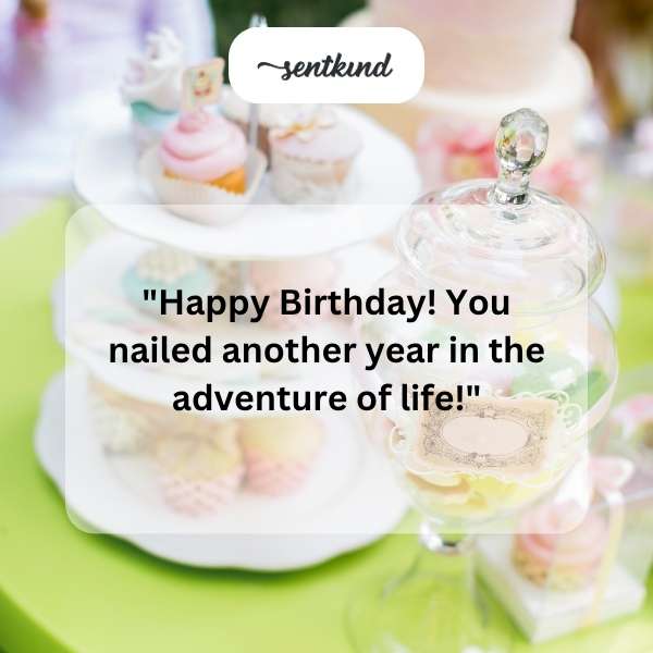 Festive birthday cake with lit candles and colorful sprinkles.