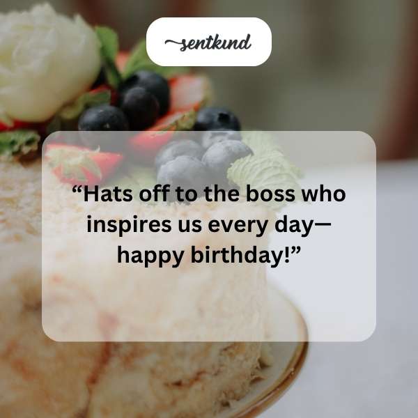 A birthday cake with candles on an office desk.