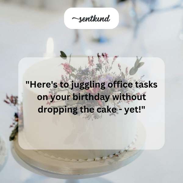 A person balances a cake while managing office supplies and working on a laptop.