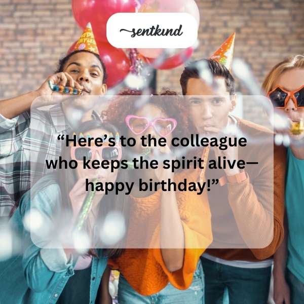 A group of coworkers joyfully celebrating a birthday with cake and balloons.