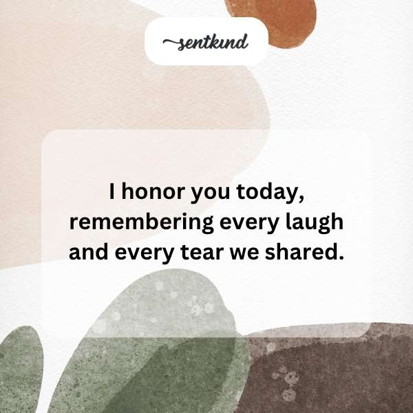 A lit candle stands against a soft background, symbolizing remembrance and celebration.