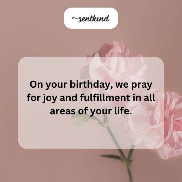 A brightly lit birthday cake with candles and a soft, divine light shining above it.