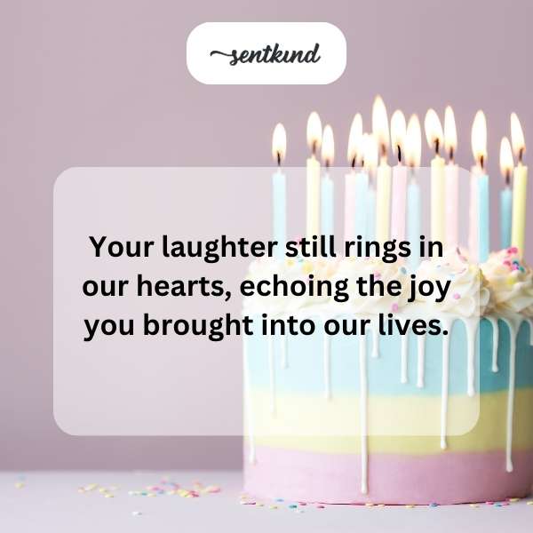 A framed photograph of a smiling father and child is displayed on a table adorned with birthday candles.